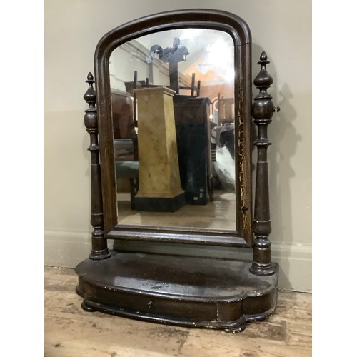 218 - A mid 19th century toilet mirror, arched glass on turned supports with a drawer to the platform base... 