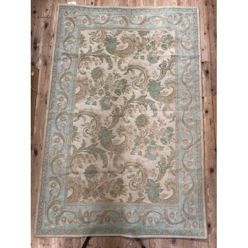 123B - A turquoise Laura Ashley rug, 175cm x 115cm