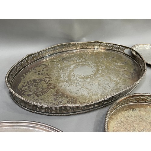 149 - A silver plated on copper galleried tray with etched centre, a twin handles tray with gadroon rim, s... 