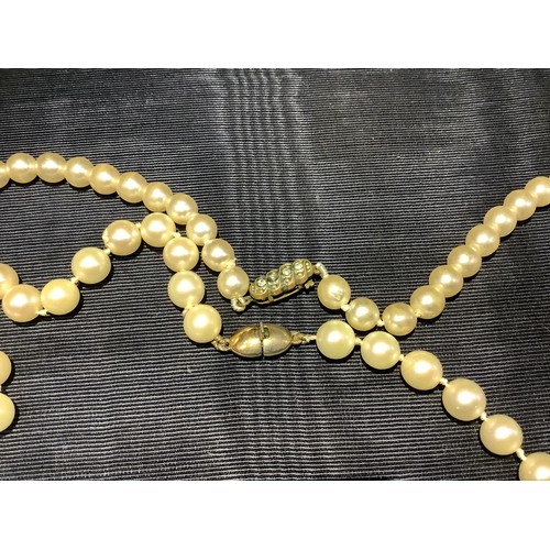 201B - A cultured pearl necklace, the 6.5mm pearls fastened with a base metal strap, approximate length 45c... 