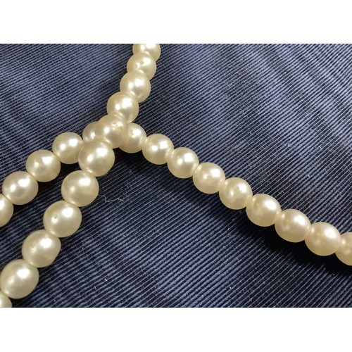 201B - A cultured pearl necklace, the 6.5mm pearls fastened with a base metal strap, approximate length 45c... 