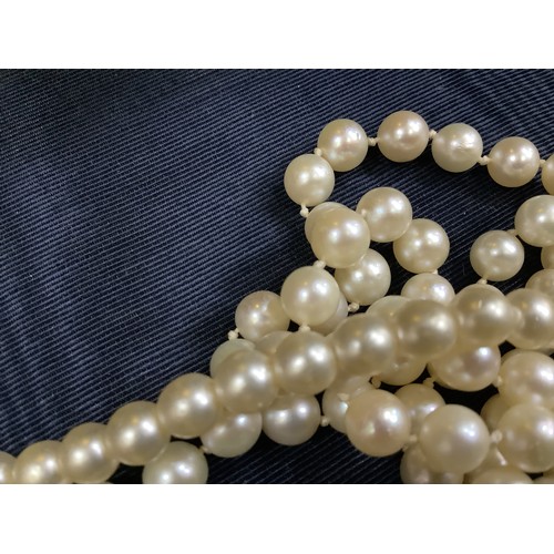 201B - A cultured pearl necklace, the 6.5mm pearls fastened with a base metal strap, approximate length 45c... 