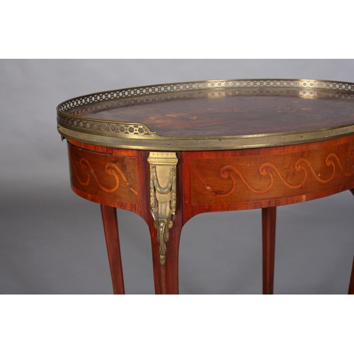 418 - A FRENCH CHINOISERIE MAHOGANY AND GILT METAL MOUNTED TABLE of oval outline with three quarter galler... 