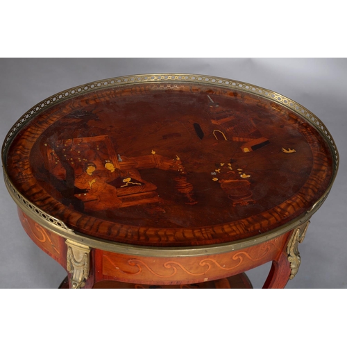 418 - A FRENCH CHINOISERIE MAHOGANY AND GILT METAL MOUNTED TABLE of oval outline with three quarter galler... 