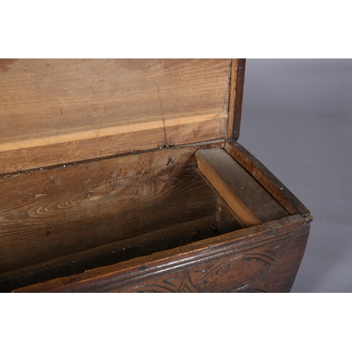 363 - A MID 17TH CENTURY OAK BOARDED CHEST, having a two plank top over the carved front, incised interloc... 