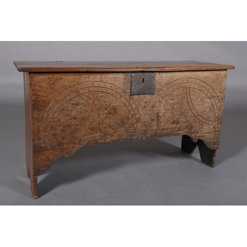 364 - A MID 17TH CENTURY OAK BOARDED CHEST, the single plank top over the carved front, incised demi-lunes... 