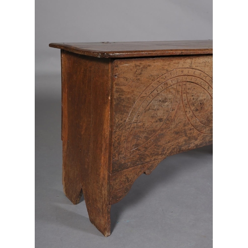 364 - A MID 17TH CENTURY OAK BOARDED CHEST, the single plank top over the carved front, incised demi-lunes... 