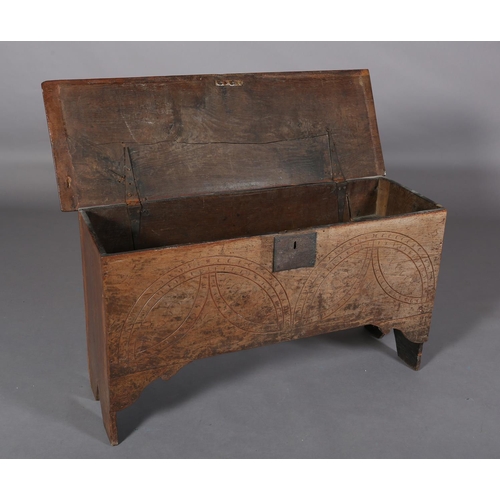 364 - A MID 17TH CENTURY OAK BOARDED CHEST, the single plank top over the carved front, incised demi-lunes... 