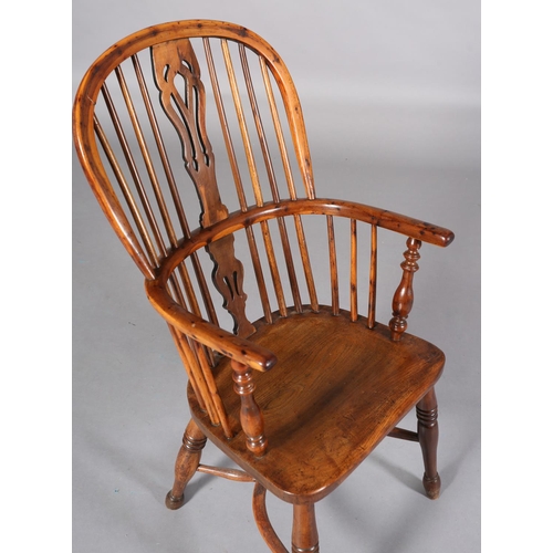 365 - A LATE 18TH CENTURY YEW-WOOD WINDSOR ARMCHAIR, having a pierced splat and rail back, elm seat, turne... 