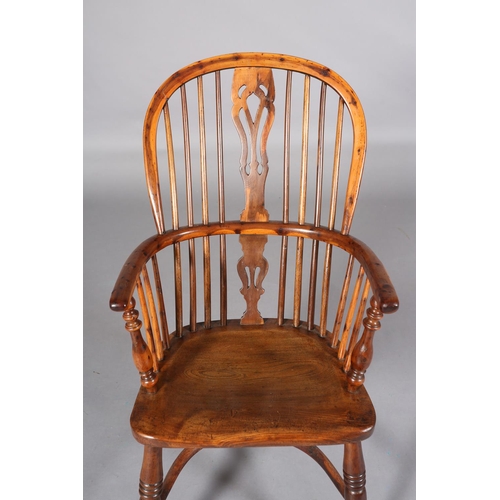 365 - A LATE 18TH CENTURY YEW-WOOD WINDSOR ARMCHAIR, having a pierced splat and rail back, elm seat, turne... 