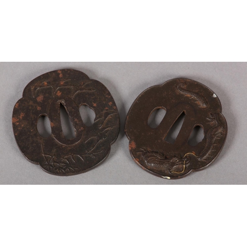 130 - A JAPANESE IRON TSUBA cast in relief with a dragon breathing flames of yellow metal, 7.5cm x 7cm, to... 