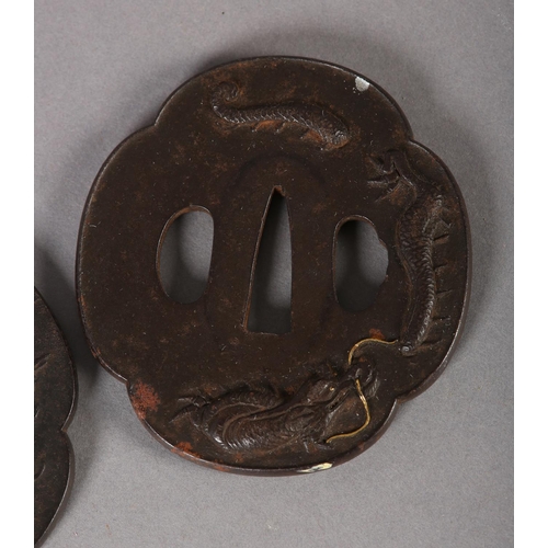 130 - A JAPANESE IRON TSUBA cast in relief with a dragon breathing flames of yellow metal, 7.5cm x 7cm, to... 