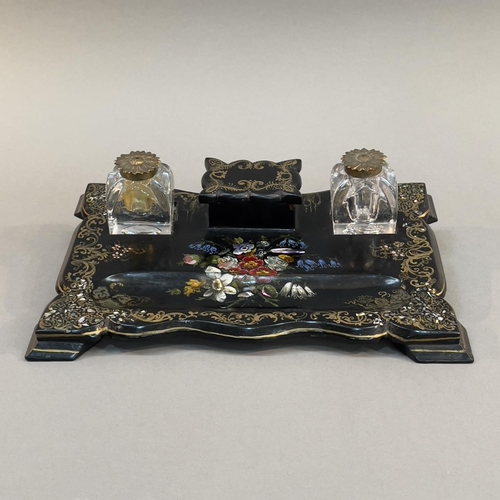 76 - A VICTORIAN PAPIER MACHE DESK STANDISH, painted and inlaid with mother-of-pearl flowers gilt scroll ... 