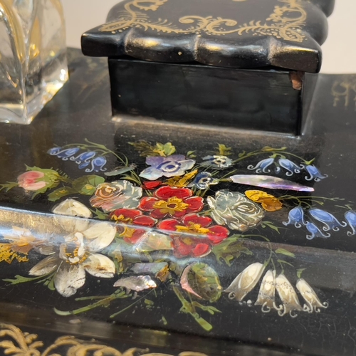 76 - A VICTORIAN PAPIER MACHE DESK STANDISH, painted and inlaid with mother-of-pearl flowers gilt scroll ... 