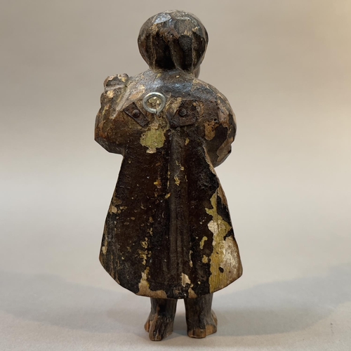 68 - AN 18TH/19TH CENTURY CARVED AND MONOCHROME PAINTED FIGURE OF AN APOSTLE, holding a scroll, 13cm high... 