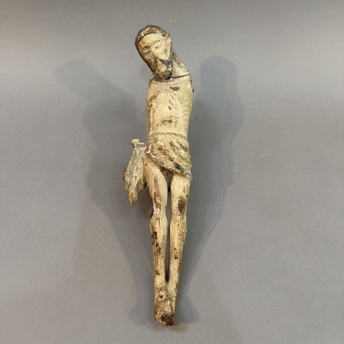 69 - AN EARLY POLYCHROME CARVED BODY OF CHRIST, in fine grain wood, probably 16th/17th century European, ... 