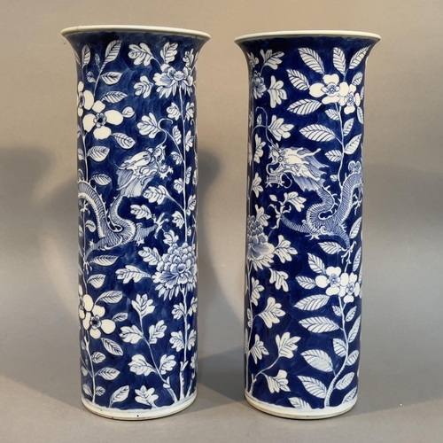 124 - A PAIR OF LATE 19TH CENTURY CHINESE BLUE AND WHITE SLEEVE VASES, Qing, painted with opposing four cl... 