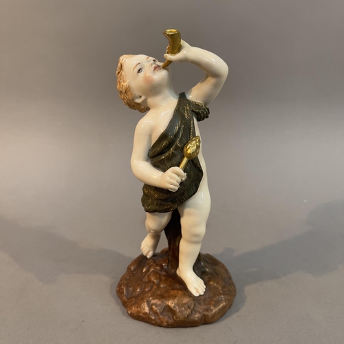 86 - A ROYAL WORCESTER FIGURE OF A DANCING CUPID, holding a horn to his lips, on naturalistic base, print... 