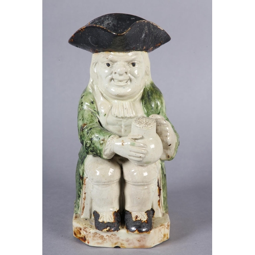 79 - A RALPH WOOD TYPE CREAMWARE TOBY JUG c1790-1800 of typical form, glazed in green and brown, 24cm hig... 