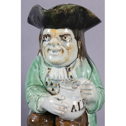 80 - AA RALPH WOOD TYPE PEARLWARE TOBY JUG C1790-1800 of typical form, glazed in green, brown and umber, ... 