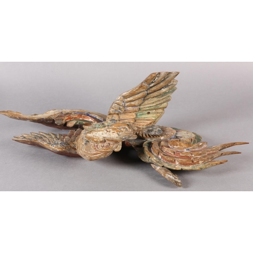 115 - AN 18TH/EARLY 19TH CENTURY POLYCHROME PAINTED PINE CARVING OF A PHOENIX AMONGST CLOUDS, 58cm wide x ... 