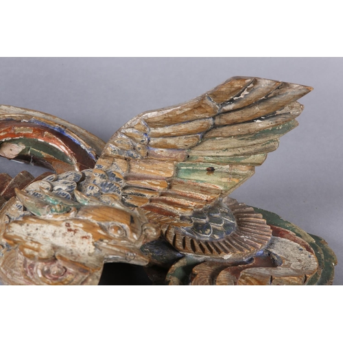 115 - AN 18TH/EARLY 19TH CENTURY POLYCHROME PAINTED PINE CARVING OF A PHOENIX AMONGST CLOUDS, 58cm wide x ... 