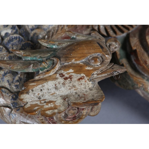 115 - AN 18TH/EARLY 19TH CENTURY POLYCHROME PAINTED PINE CARVING OF A PHOENIX AMONGST CLOUDS, 58cm wide x ... 