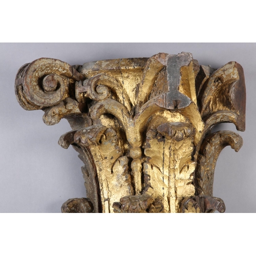 63 - AN 18TH CENTURY GILDED OAK CAPITOL, carved with acanthus and scrollwork, 39cm high x 42cm wide (Ship... 