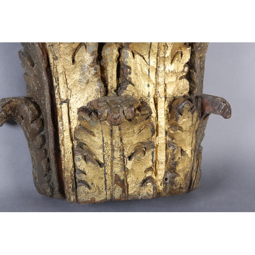 63 - AN 18TH CENTURY GILDED OAK CAPITOL, carved with acanthus and scrollwork, 39cm high x 42cm wide (Ship... 