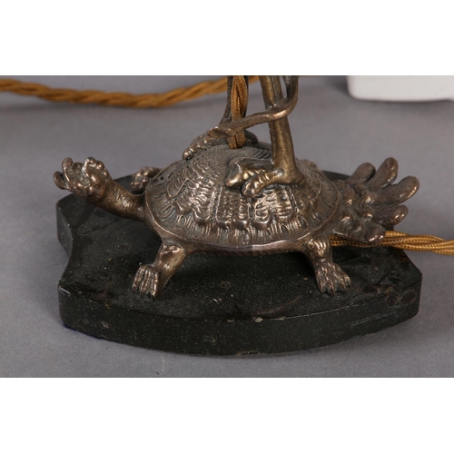 38 - A PAIR OF EPNS TABLE LAMPS IN THE FORM OF A CRANE PERCHED ON THE BACK OF A TURTLE, on black marble p... 