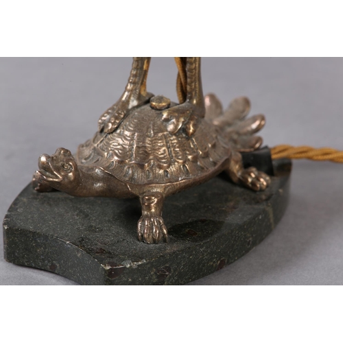 38 - A PAIR OF EPNS TABLE LAMPS IN THE FORM OF A CRANE PERCHED ON THE BACK OF A TURTLE, on black marble p... 