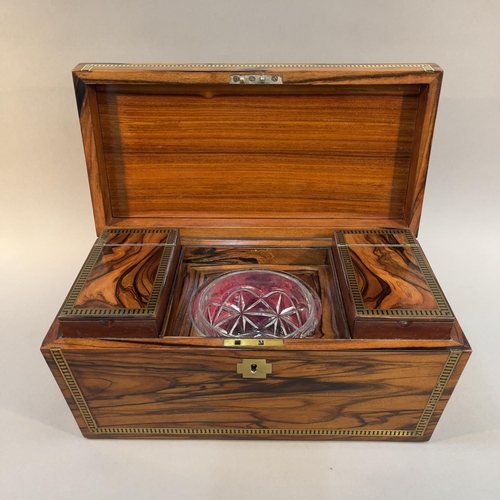 74 - A COROMANDEL WOOD AND BRASS INLAID TEA CADDY, early 19th century, of sarcophagus form with lion mask... 