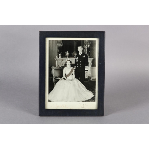 2 - QUEEN ELIZABETH II AND PHILIP, DUKE OF EDINBURGH, a signed photograph dated 1954, in dark blue leath... 