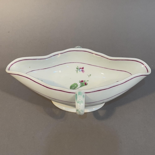 94 - AN 18TH CENTURY ROYAL VIENNA PORCELAIN DOUBLE LIPPED SAUCEBOAT WITH LOOP HANDLES,  painted in puce a... 