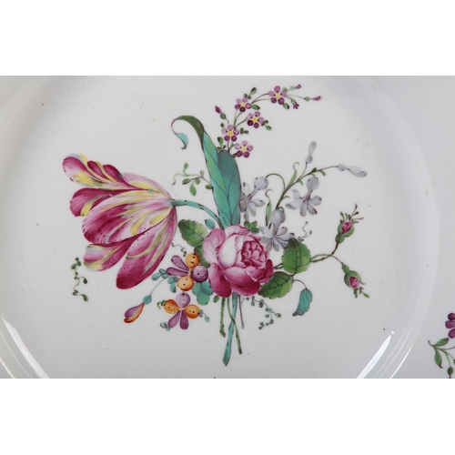 98 - AN 18TH CENTURY HOCHST PORCELAIN PLATE, polychrome painted with tulip, peony and other blossom, brow... 