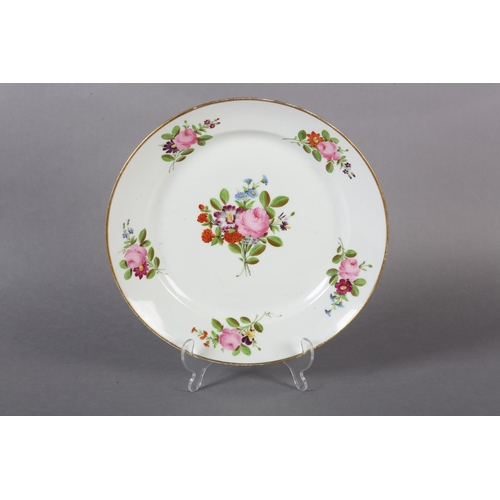 99 - A LATE 18TH CENTURY EUROPEAN PORCELAIN PLATE, polychrome painted with peony and other blossom to the... 