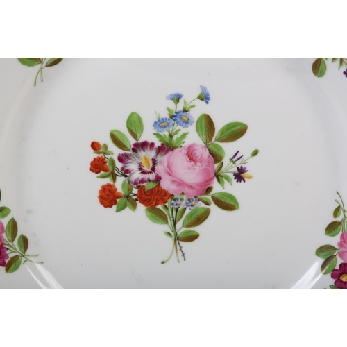 99 - A LATE 18TH CENTURY EUROPEAN PORCELAIN PLATE, polychrome painted with peony and other blossom to the... 