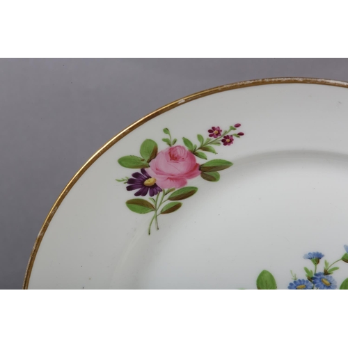 99 - A LATE 18TH CENTURY EUROPEAN PORCELAIN PLATE, polychrome painted with peony and other blossom to the... 