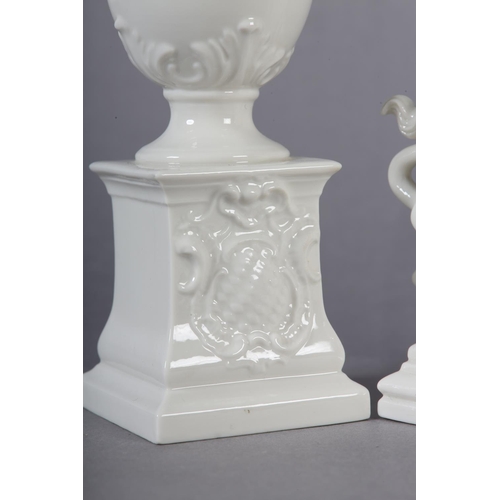 106 - A PAIR OF LATE 19TH CENTURY NYMPHENBURG WHITE PORCELAIN VASES RAISED ON INTEGRAL PLINTHS, 15.5cm tog... 