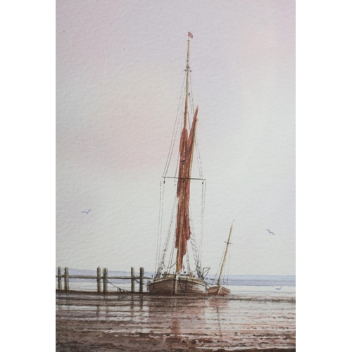 318 - ARR ALAN WHITEHEAD (b.1952), Fishing boat and sailing dinghy at low tide, watercolour, signed to low... 