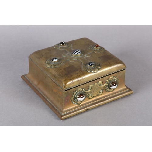 70 - A VICTORIAN BRASS GAMES BOX COLLET SET WITH BANDED AGATE CABOCHONS IN STRAPWORK TO THE LID AND FRONT... 