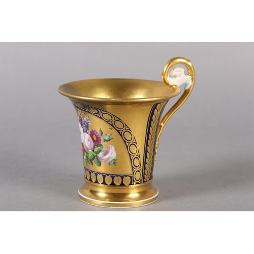 102 - A 19TH CENTURY CONTINENTAL GILT CHOCOLATE CUP, in the manner of Schoelcher the moulded handle termin... 