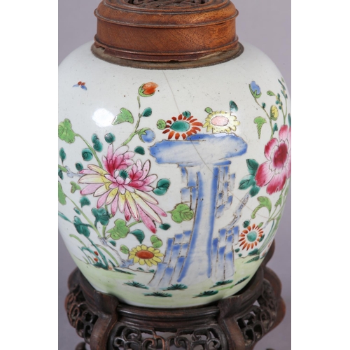 121 - AN 18TH CENTURY CHINESE FAMILLE ROSE GINGER JAR, the ovoid body painted with chrysanthemum and peony... 