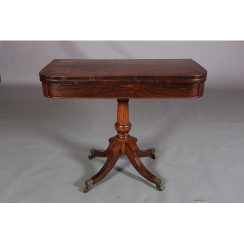 397 - A LATE REGENCY ROSEWOOD CARD TABLE, the rectangular fold-over top lined in baize, on a vase turned c... 