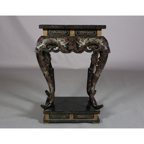 112 - A CHINESE BLACK LACQUERED TABLE OR STAND, Qing, the rectangular top painted in iron red, green blue ... 