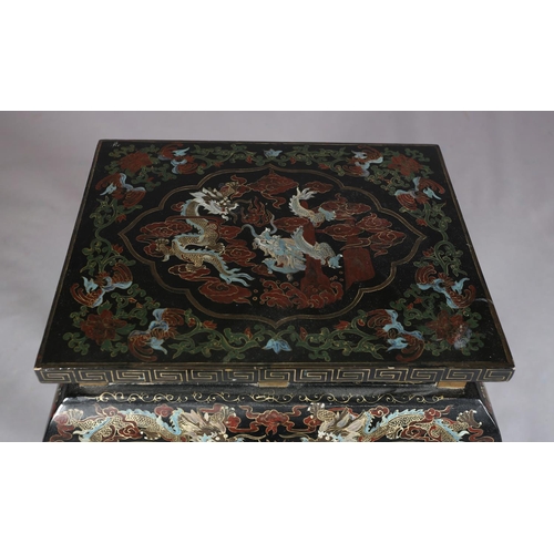 112 - A CHINESE BLACK LACQUERED TABLE OR STAND, Qing, the rectangular top painted in iron red, green blue ... 