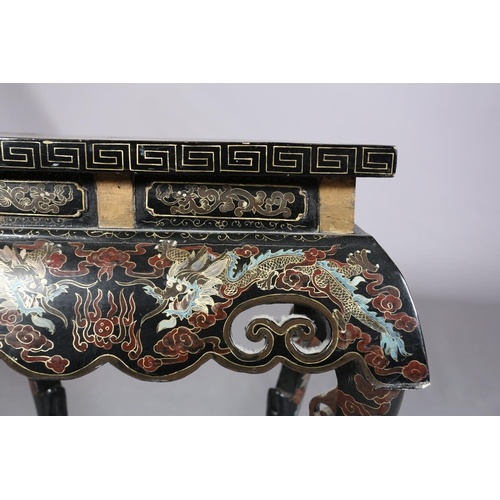 112 - A CHINESE BLACK LACQUERED TABLE OR STAND, Qing, the rectangular top painted in iron red, green blue ... 