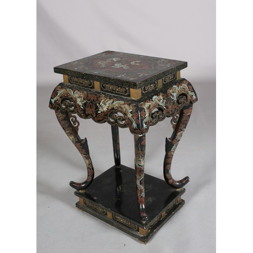 112 - A CHINESE BLACK LACQUERED TABLE OR STAND, Qing, the rectangular top painted in iron red, green blue ... 