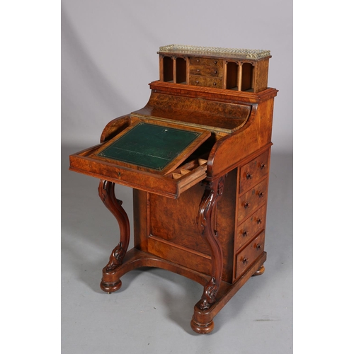 392 - A VICTORIAN FIGURED WALNUT DAVENPORT, having a pierced gilt metal gallery, pop-up back fitted with t... 