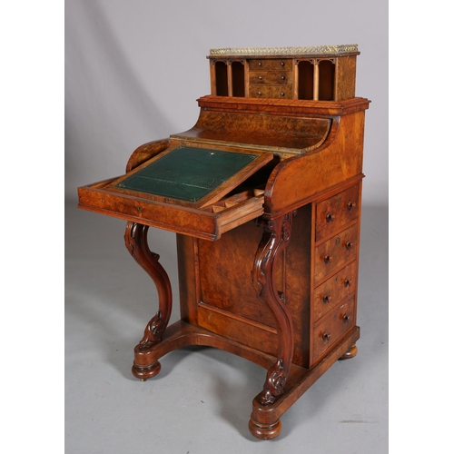 392 - A VICTORIAN FIGURED WALNUT DAVENPORT, having a pierced gilt metal gallery, pop-up back fitted with t... 